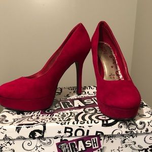 Red suede pumps